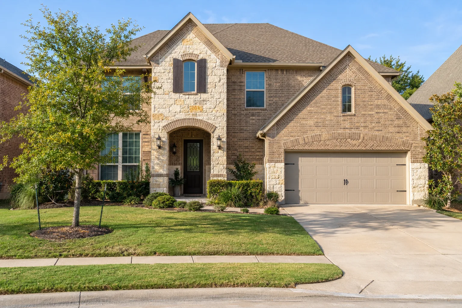 Newer two-storey brick and stone home in a master-planned McKinney, TX neighborhood